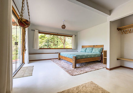 Spacious master suite with private terrace king-size bed and mountain views