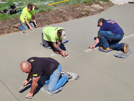 Kramer Enterprises Working on Concrete Driveway Step by Step - Smoothing
