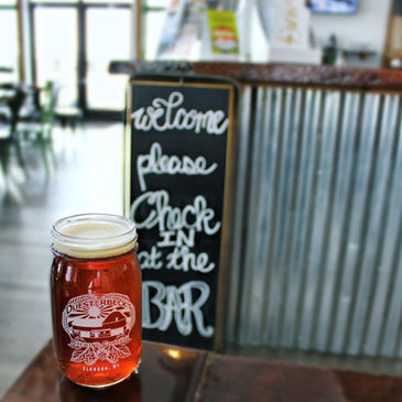 Irish Red Ale in front of Bar