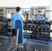 Young men lifting weights