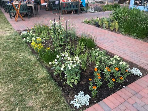 this image shows the brick walkways forming garden beds amongst dining guests