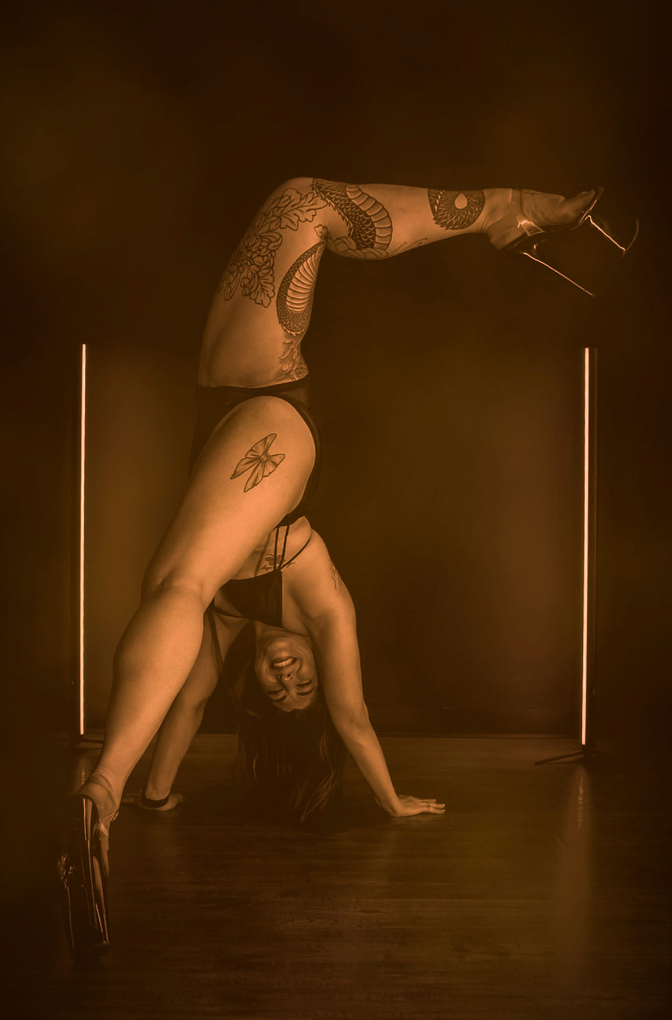 A woman performing a heels choreography trick.