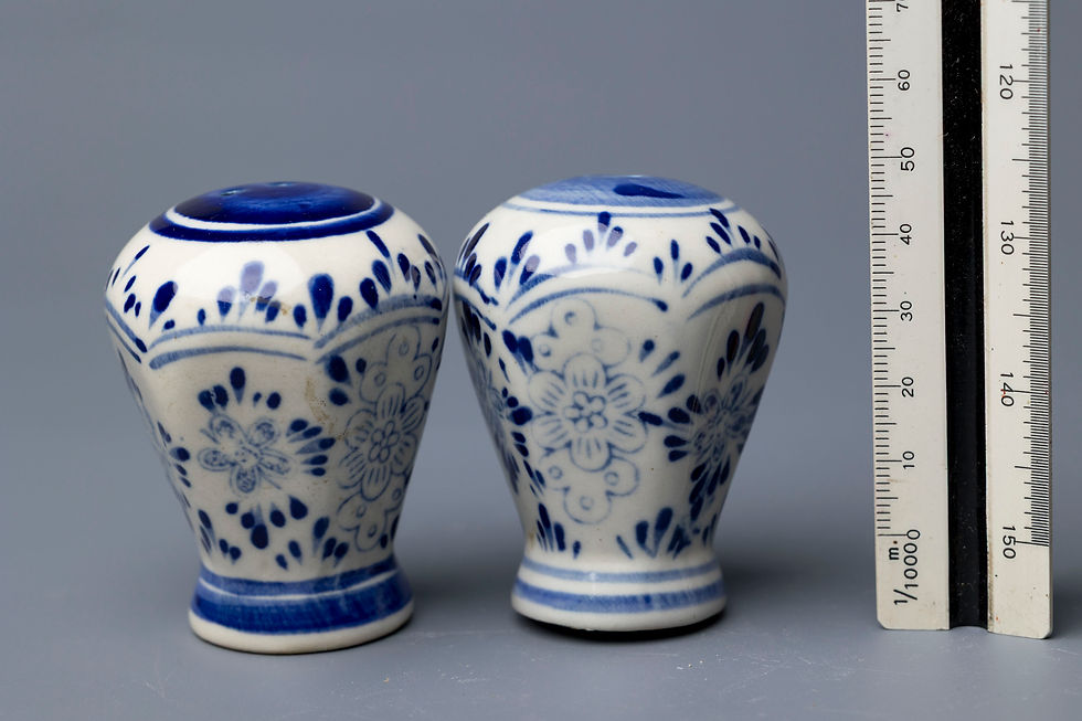 This charming pair of ceramic salt and pepper shakers is decorated in a traditional Talavera-style, a type of majolica