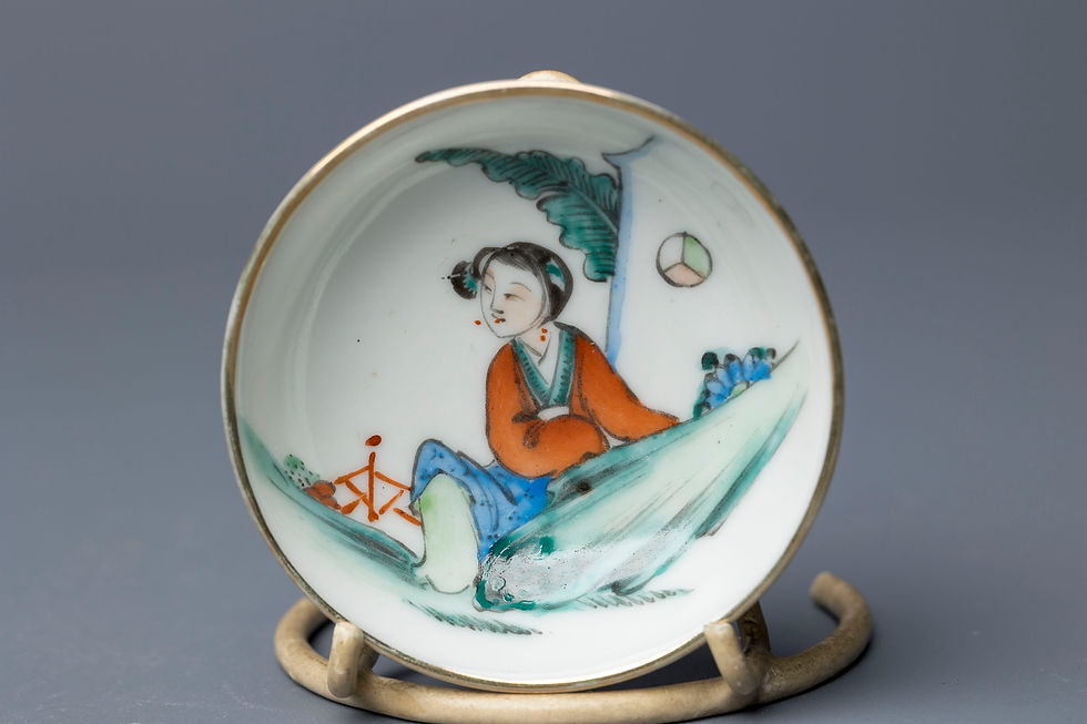This delicate hand-painted saucer features a serene female figure in traditional Chinese dress