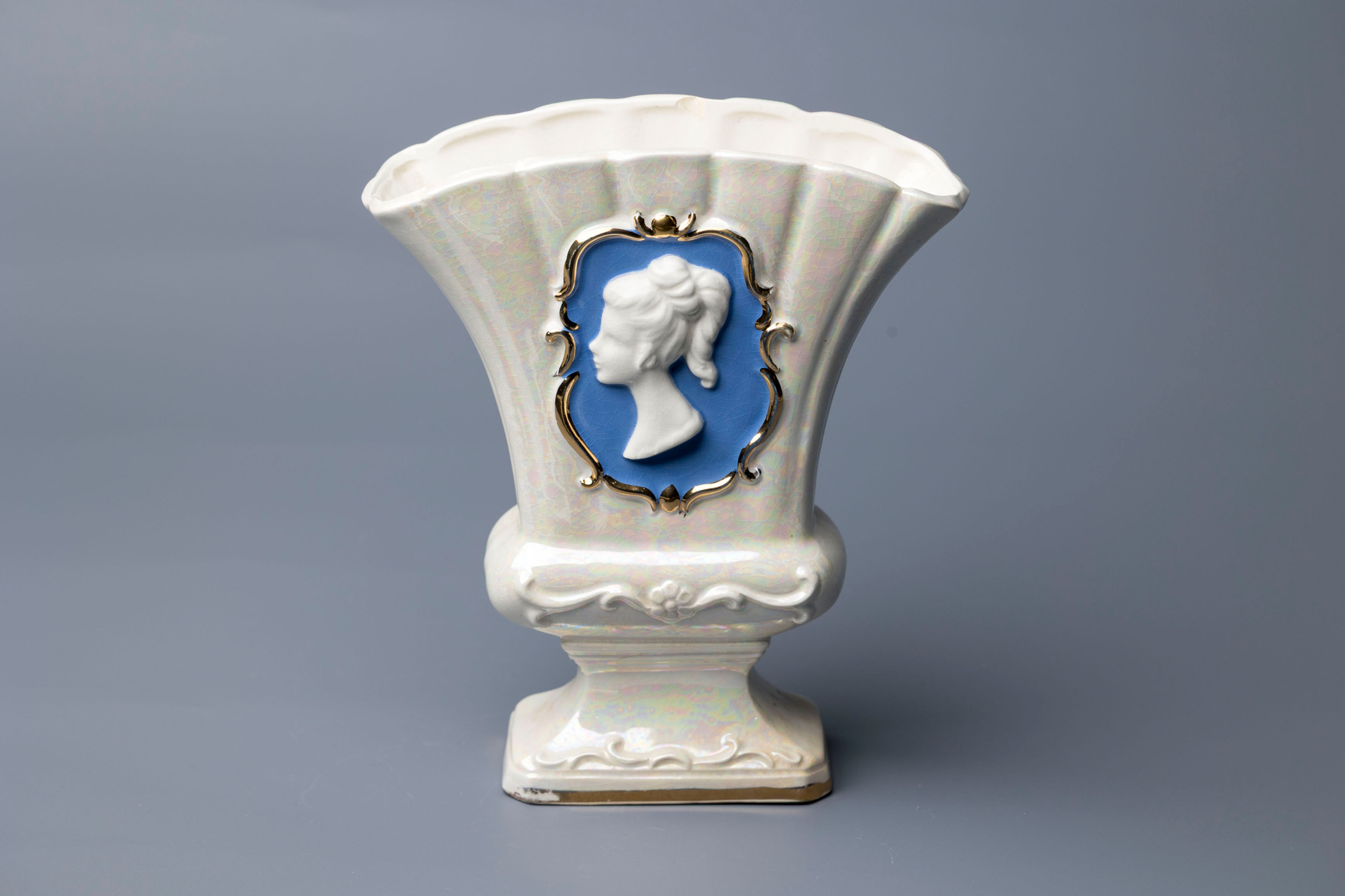 This fan-shaped vase exemplifies mid-20th-century European decorative porcelain, particularly popular in West Germany