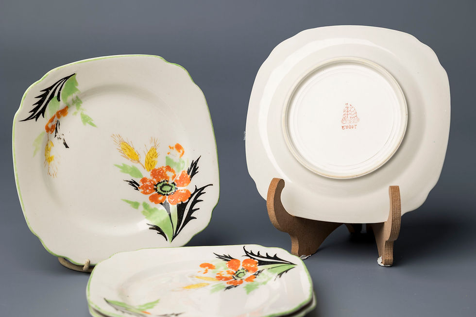 This charming vintage part-dessert set features a vivid hand-painted poppy motif, with bold orange-red blossoms and stylized