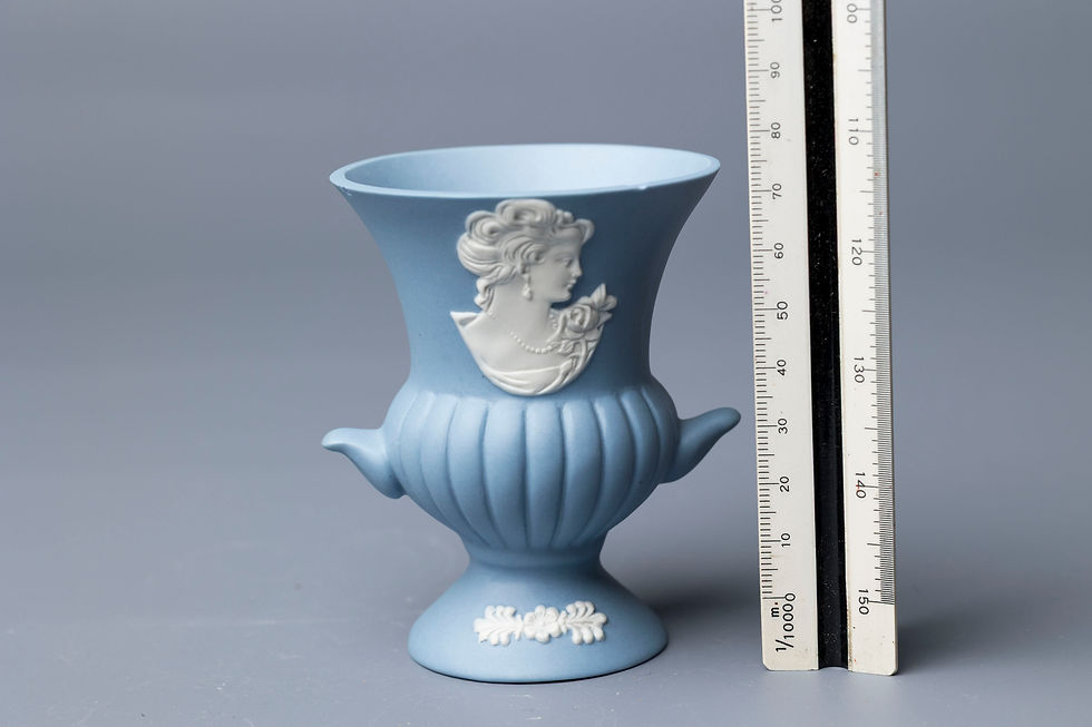 possibly Wedgwood-style reproduction History: This small two-handled urn-form vase is crafted in the iconic jasperware style