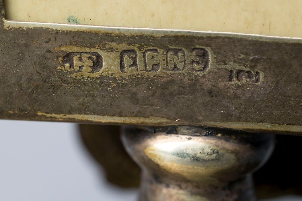 This charming desk accessory is a perpetual calendar featuring a removable set of date, month, and weekday cards displayed