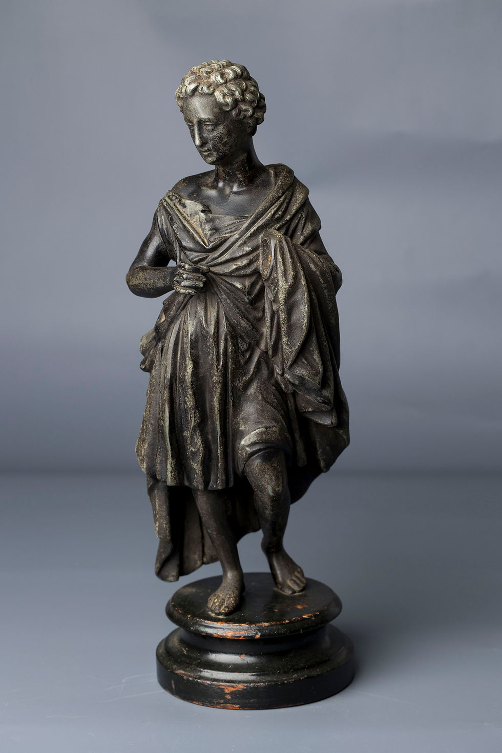 An elegant late 19th to early 20th-century classical bronze figurine, showcasing traditional Greco-Roman style and craftsmans