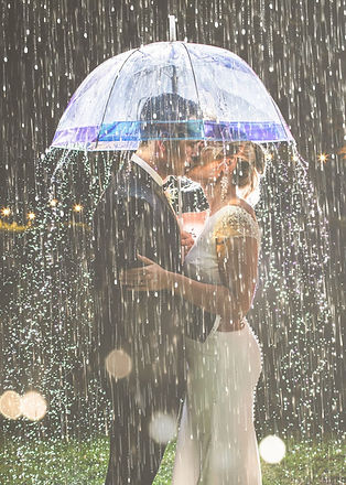 A wedding scene where bride and groom kiss under an umbrella, showing excellent customer service