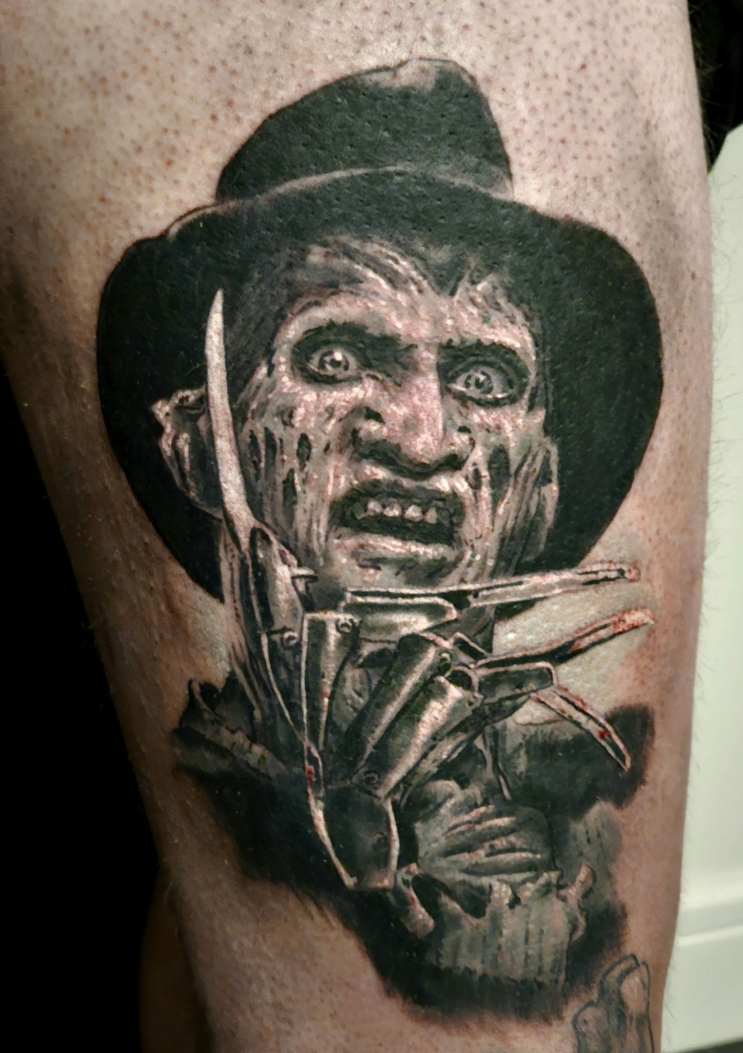 Black and grey Freddy Krueger portrait tattoo