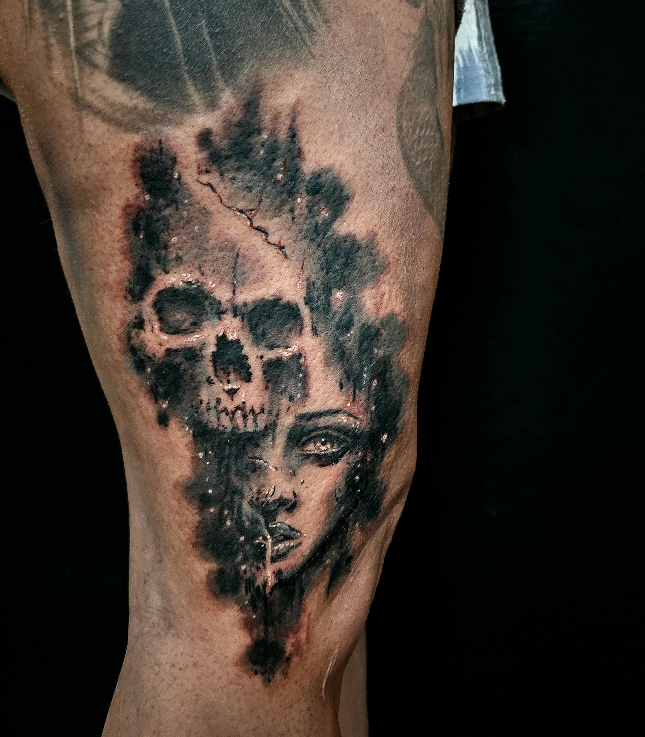 Surreal black and grey portrait divided between a woman and skull