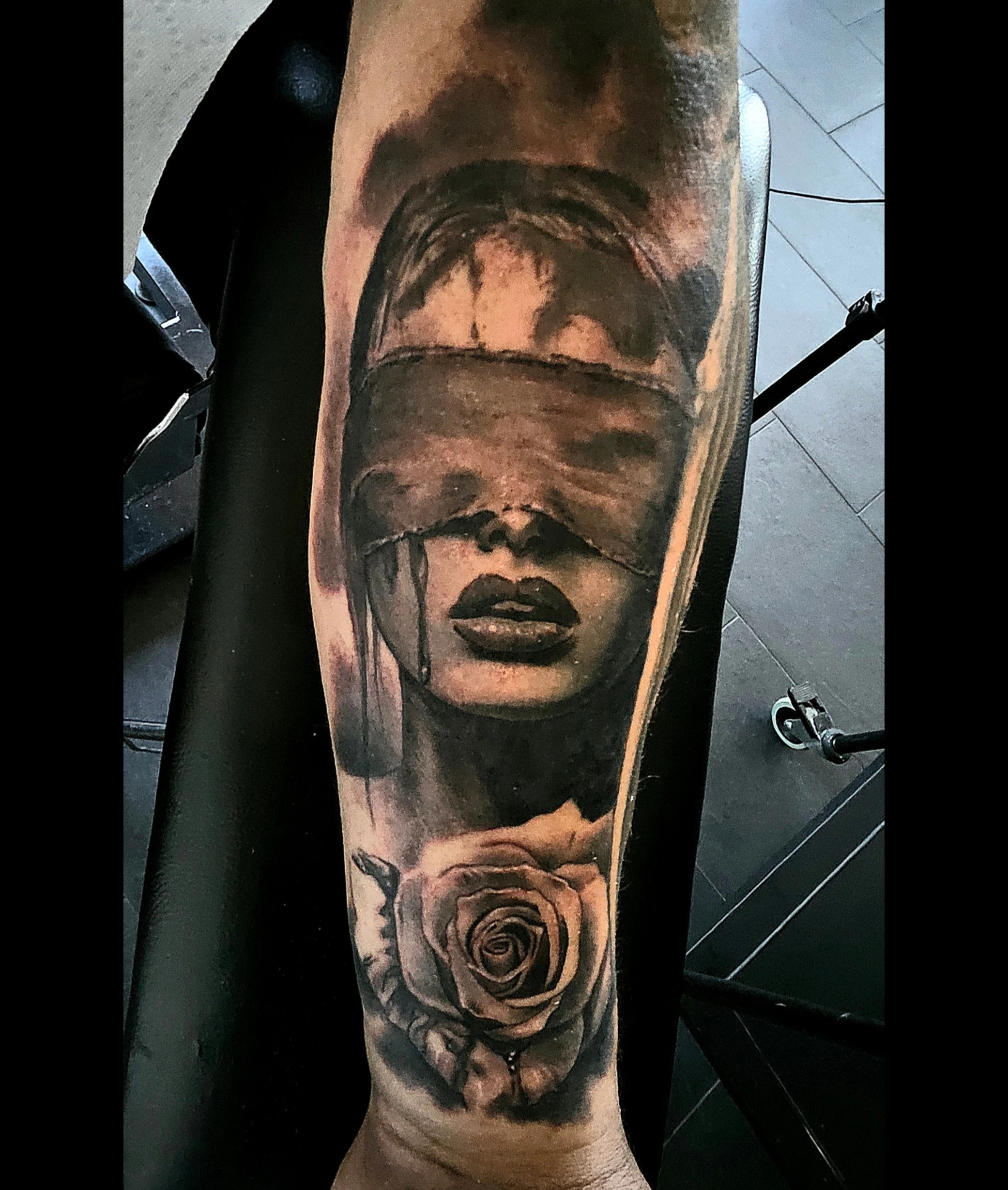 Black and grey blindfolded woman portrait with a rose