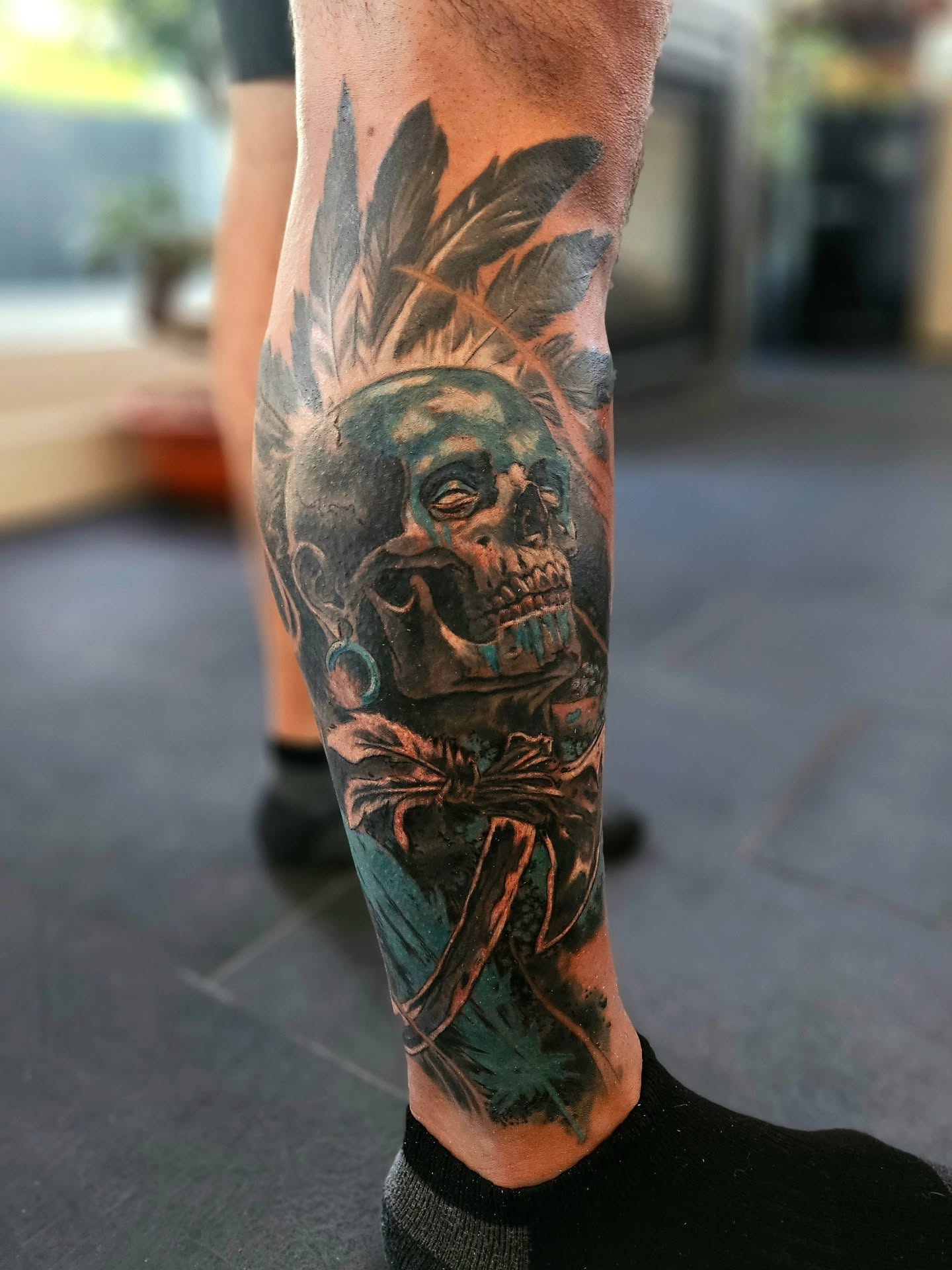 Black and grey Indigenous portrait tattoo