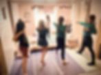 Girls practicing yoga poses in a home studio
