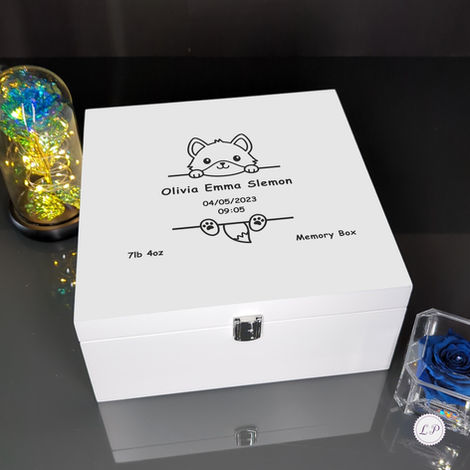 A white memory box with a cute animal face drawing, personalised with the name Olivia Emma Slemon, birth date 04/05/2023, tim