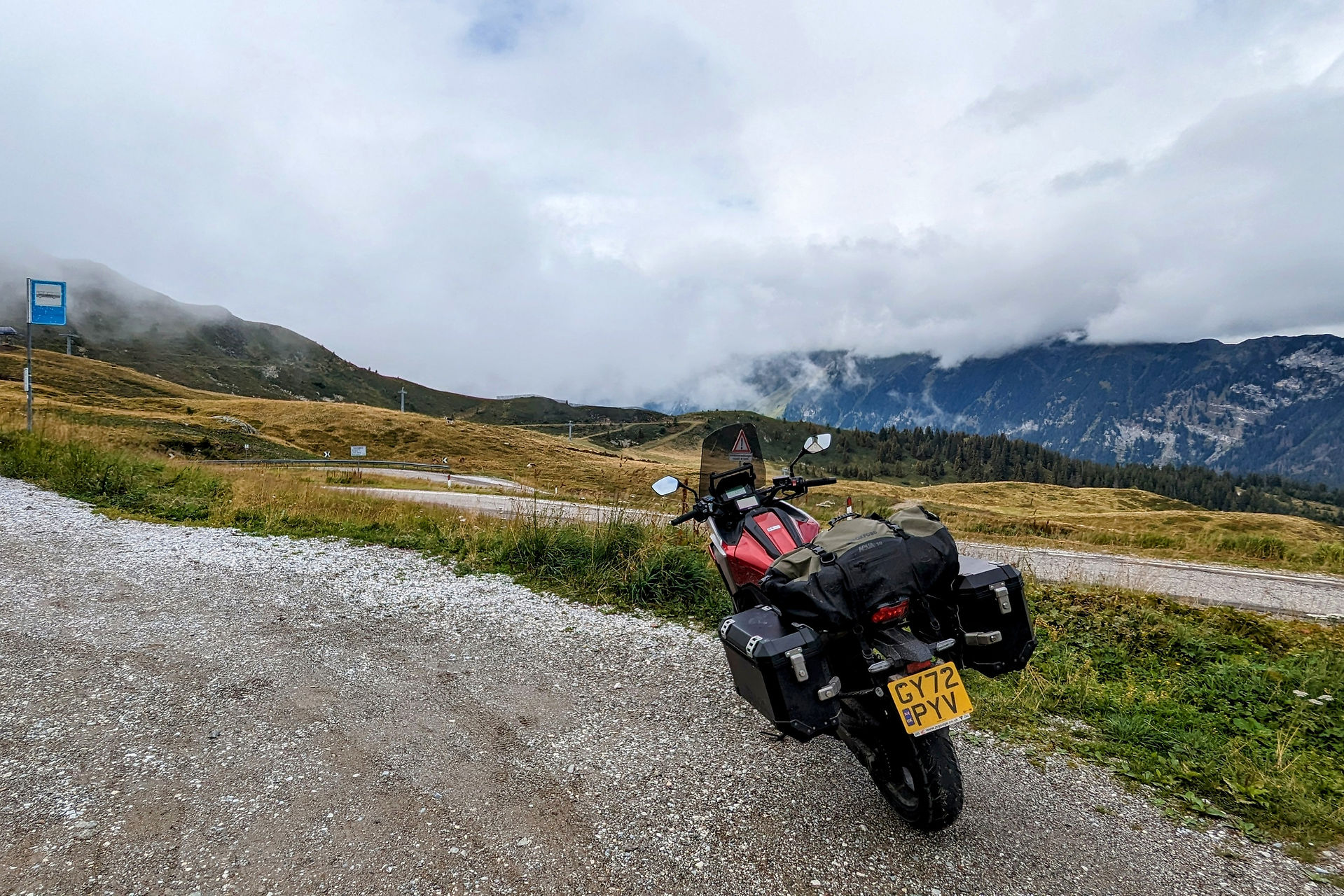 A motorcycle parked next to Passo Giovo Jaufenpass