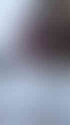 A sign directing to motorcycle parking in Claviere, Italy