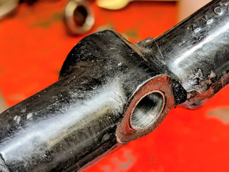 A black Norton motorcycle frame with a bushed gearbox pivot