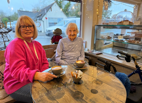 Angela and Enid enjoying coffee