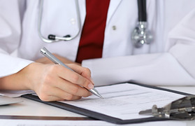 Doctor Checking a Form