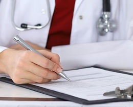 Doctor Checking a Form