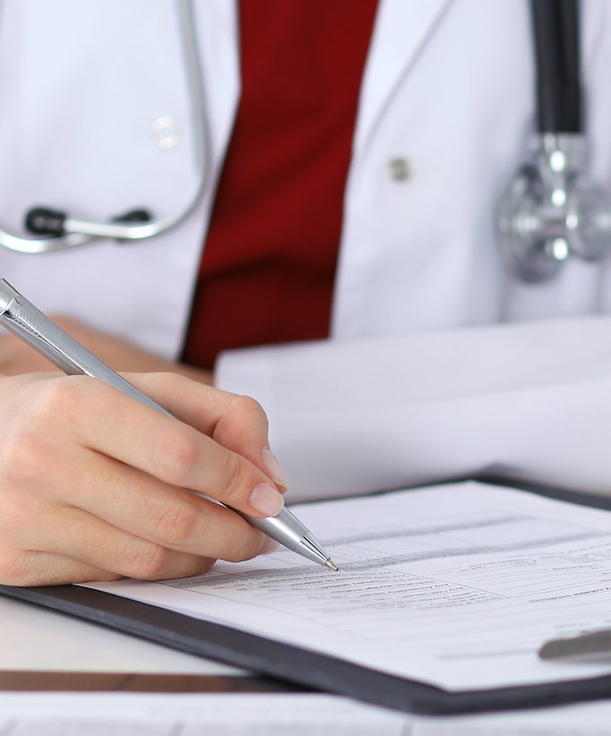 Doctor Checking a Form