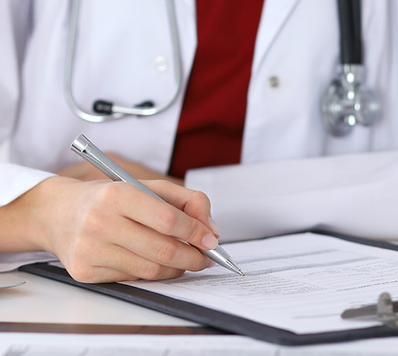 Doctor Checking a Form