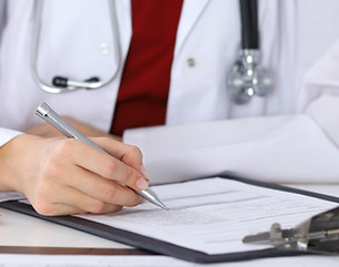 Doctor Checking a Form