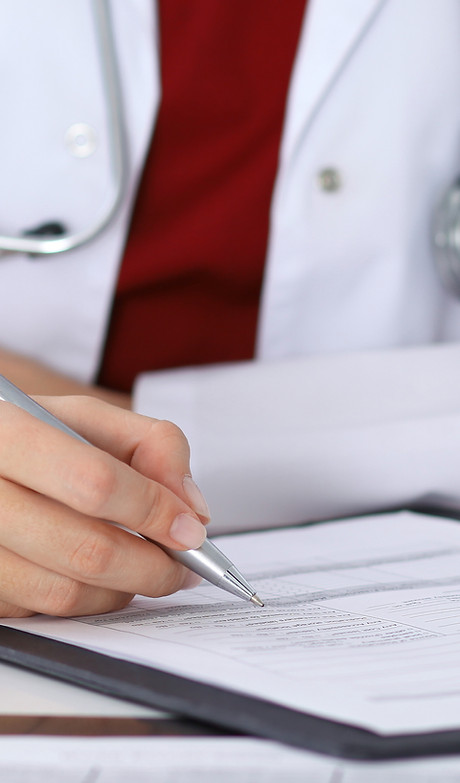 Doctor Checking a Form