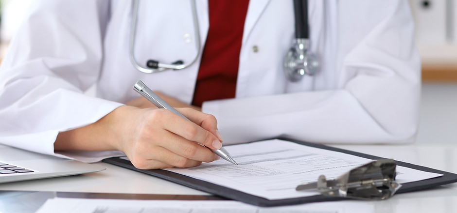 Doctor Checking a Form