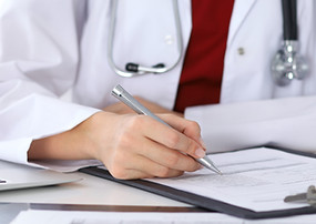 Doctor Checking a Form