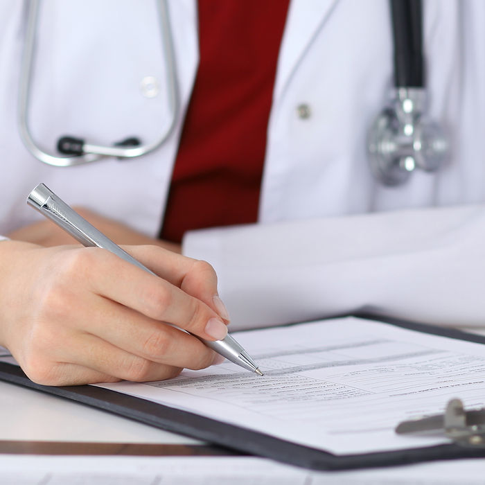 Doctor Checking a Form