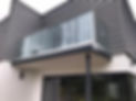 Frameless glass balcony on a building