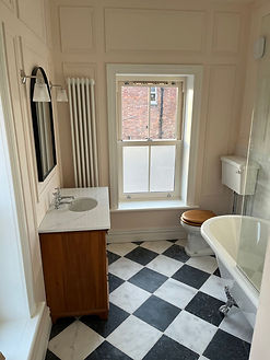 Bathroom with black and white tiles
