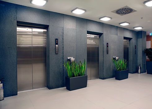 Lifts on a grey wall