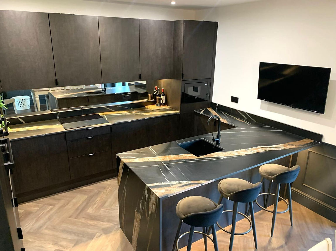 black and sand coloured marble worktop in kitchen