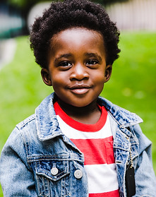 storyblocks-child-with-curly-hair-outsid