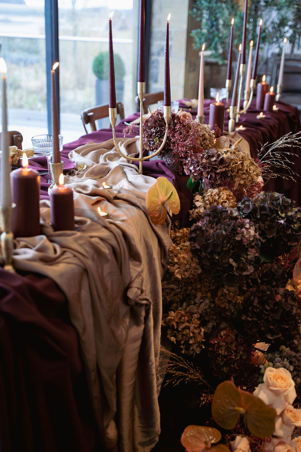 Burgundy table styling at The Byirs with table drapes, florals and candles