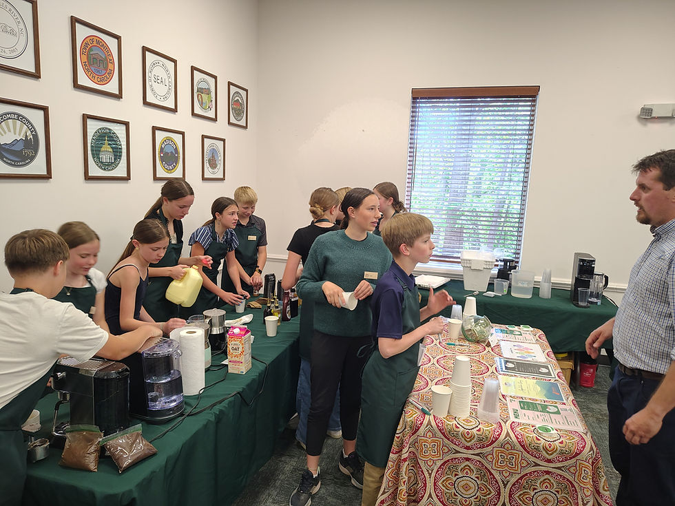 Evergreen Community Charter School students take an order for "Appalachian Strong", a custom drink they designed for the WNC Resilience Project Spring Convening. In addition to serving professional-quality beverages, they also delivered a powerful example of experiential learning in action.