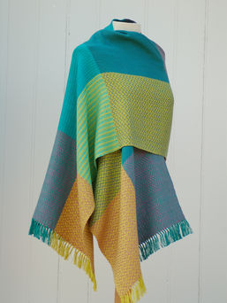 Handwoven wrap yellow and green on tailors dummy