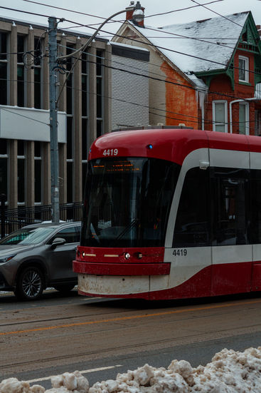 Red and white streetcar 4419 on a city street