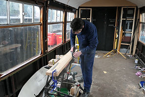 James Broughton planing wood to create b