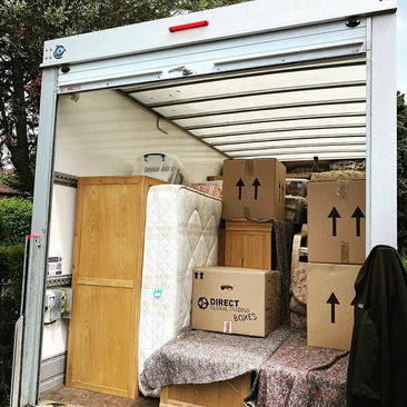 van open full of boxes
