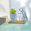 Thumbnail: Artificial Succulent in Unique Figurine Pot with Metal Stick Figure