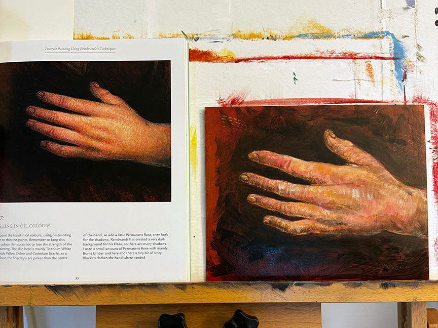 A book page shows a hand painting technique, next to a similar hand painting on a wood panel. Both images have dark, rich backgrounds.