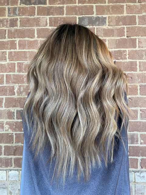Dimensional blonde with a blend of highlights and lowlights for added depth and brightness in Suwanee, GA.