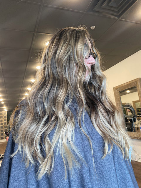 Dimensional blonde with a blend of highlights and lowlights for added depth and brightness in Suwanee, GA.