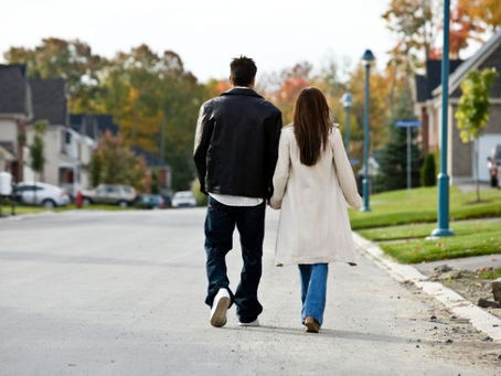 couple walking in safe neighborhood and hoa
