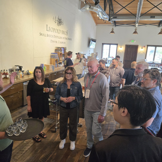 A group of people learning to make craft cocktails